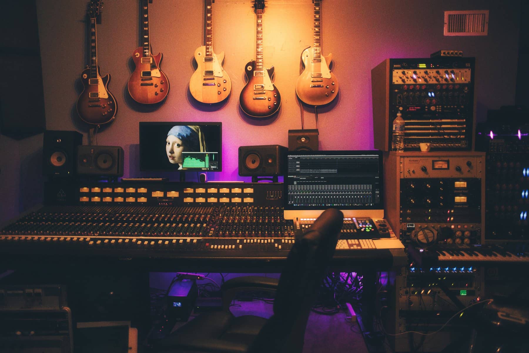 Recording studio with guitars and a mixing desk
